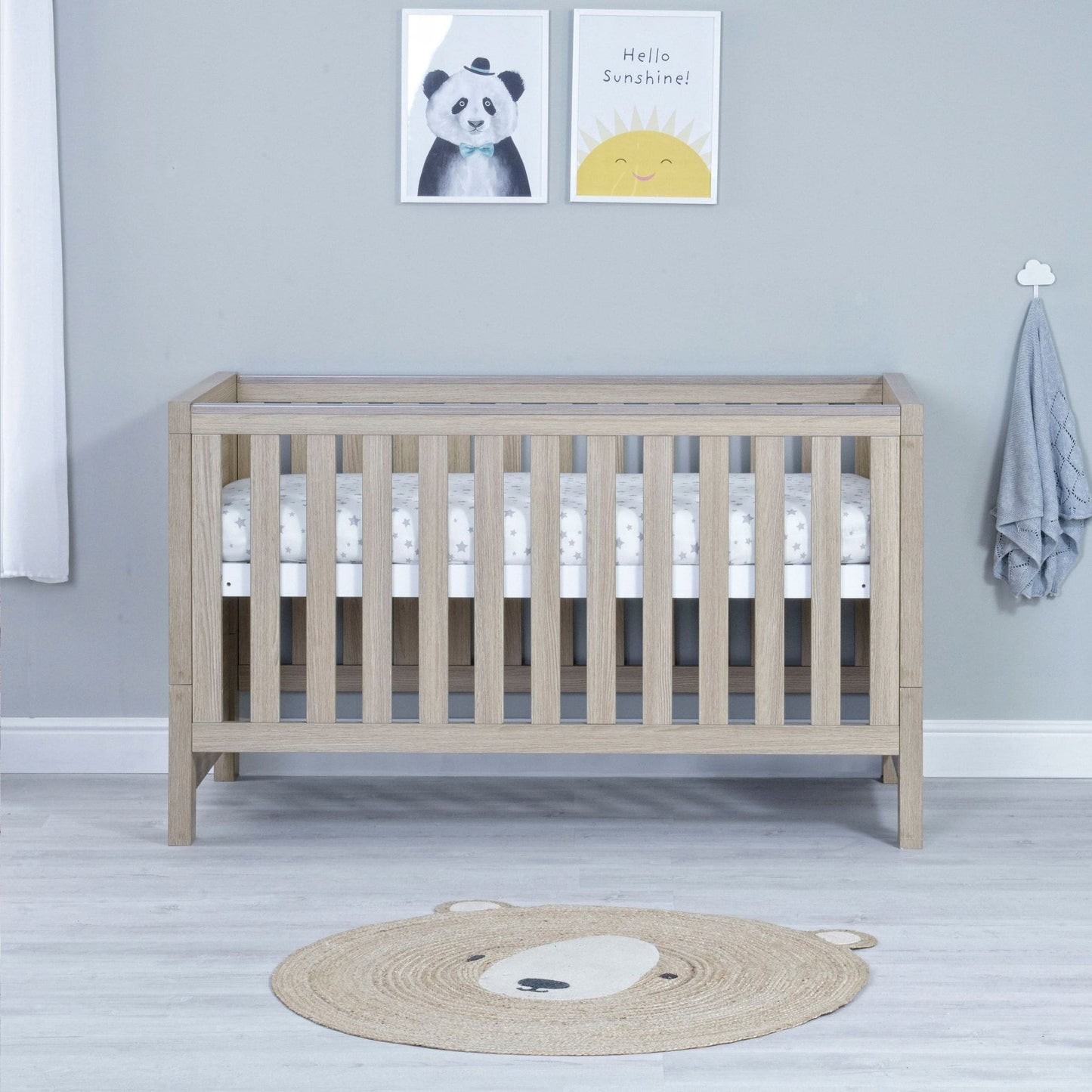 Babymore-Luno-Cot-Bed-oak-in-nursery-setting-as-cot-side2