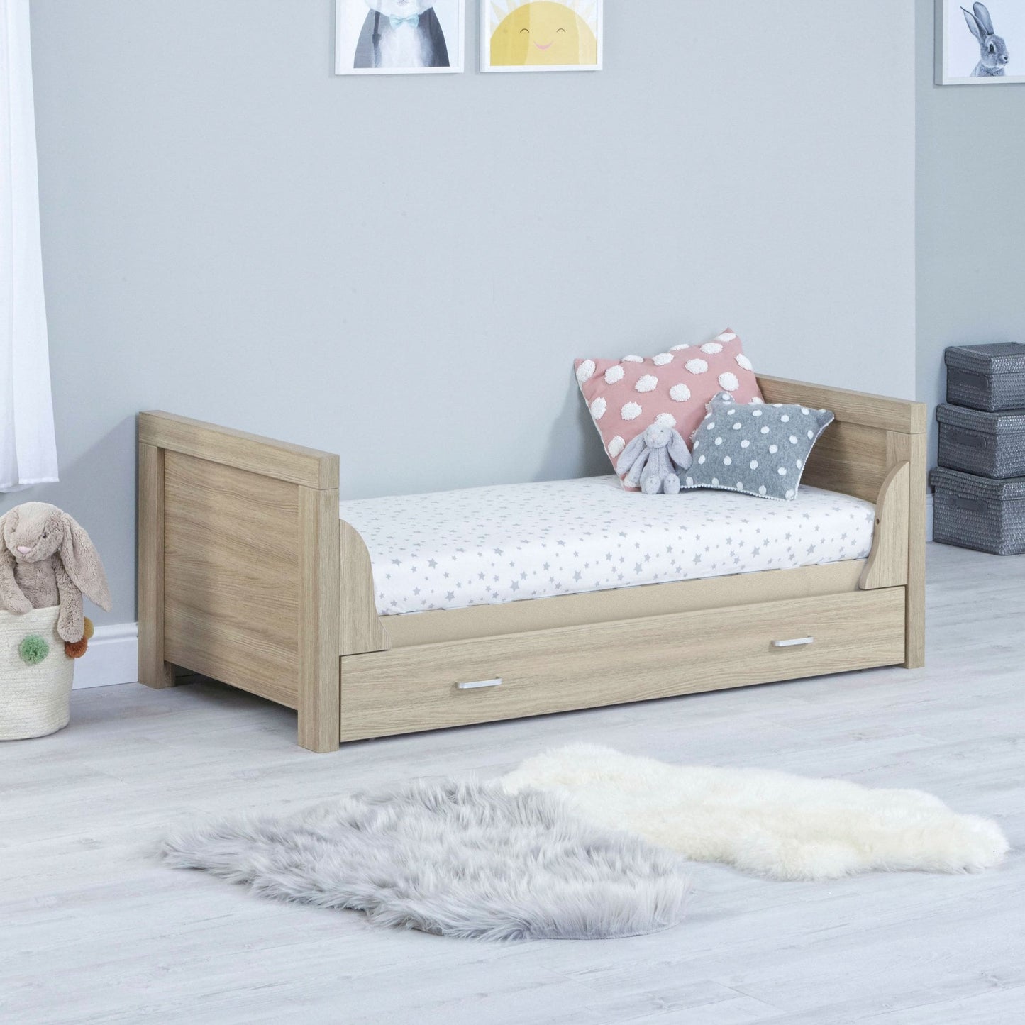 Babymore-Luno-Cot-Bed-with-drawer-oak-in-nursery-setting-as-cot-bed-side