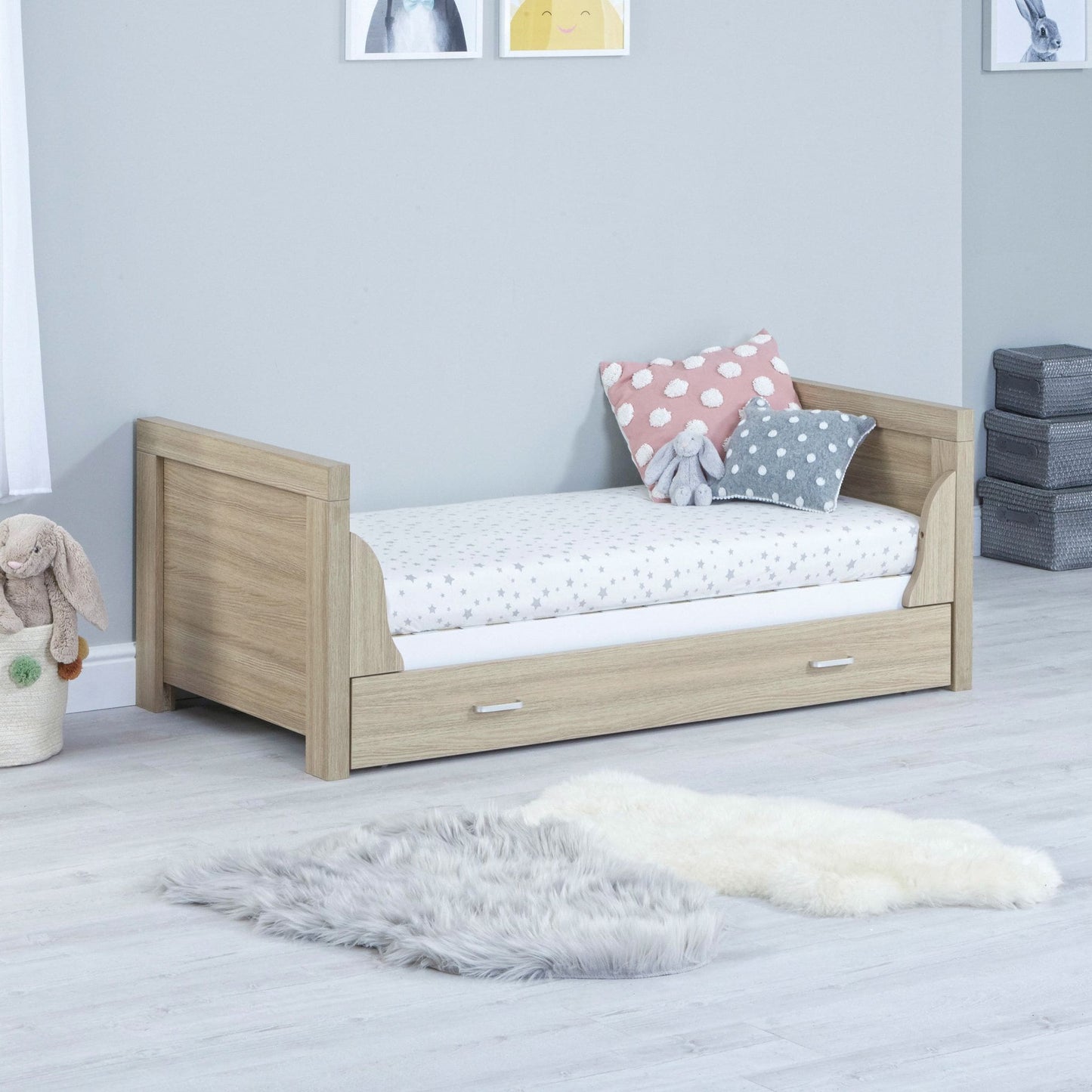 Babymore-Luno-Cot-Bed-oak-white-with-drawer-in-nursery-setting-as cot -bed-side