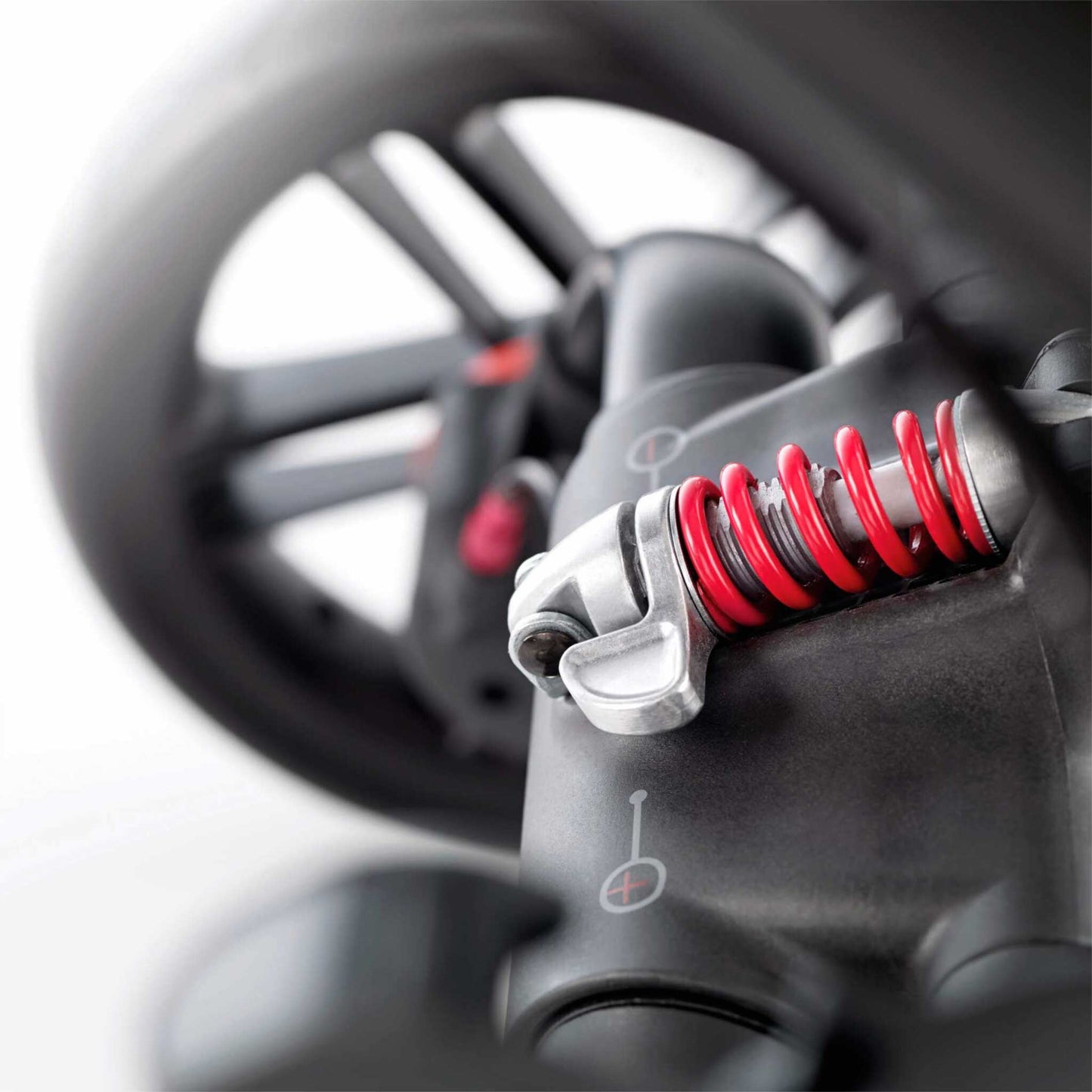 Trider-wheel-suspension- Black-close-up-of-suspension-coil