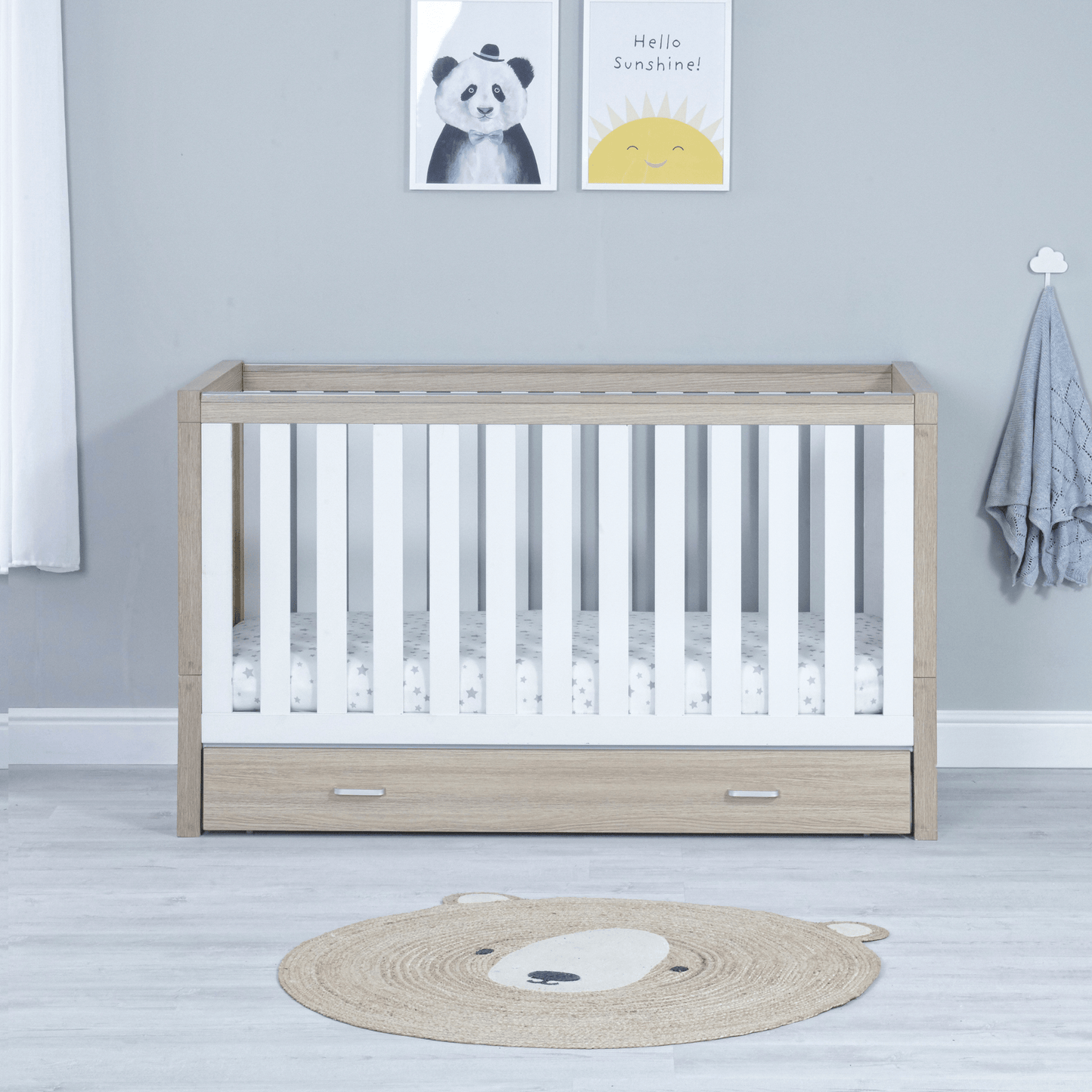 Luno-3-piece-nursery-set-with-drawer-on-cot-oak-white-showing-cotbed-only