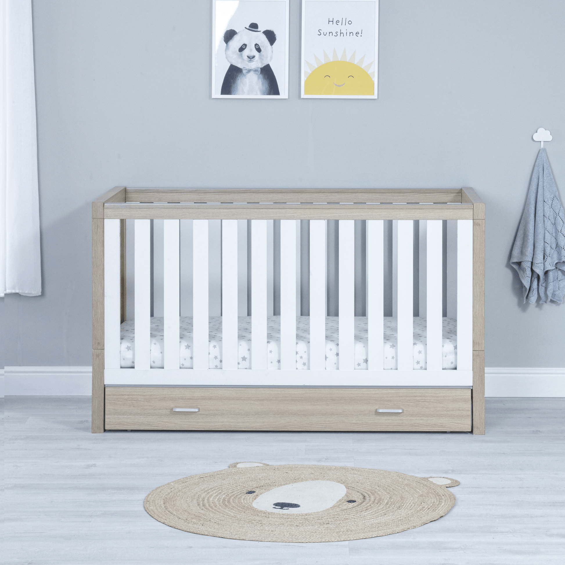 Luno-3-piece-nursery-set-with-drawer-on-cot-oak-white-showing-cotbed-only