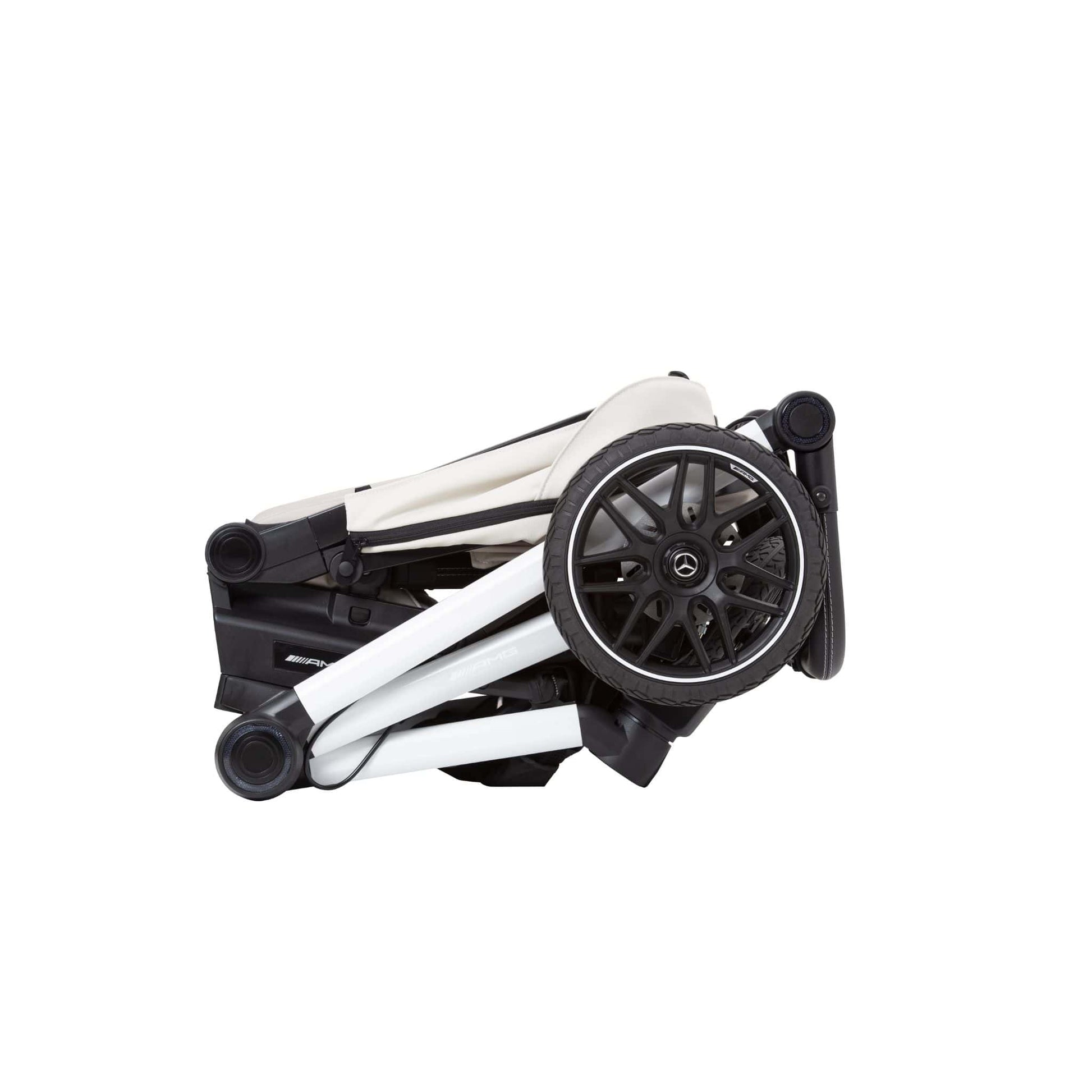 Folded  bright light colour stroller with black wheels on a white background